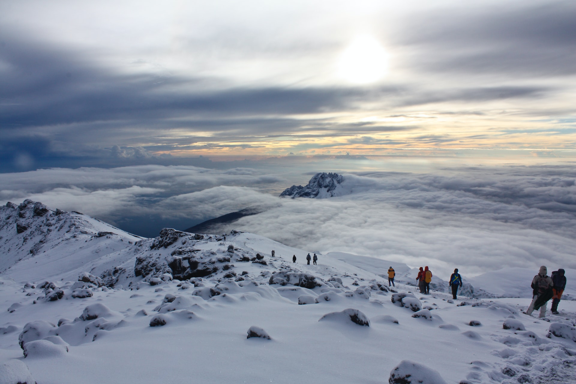 Climbers on the snow-capped summit ridge of Mount Kilimanjaro